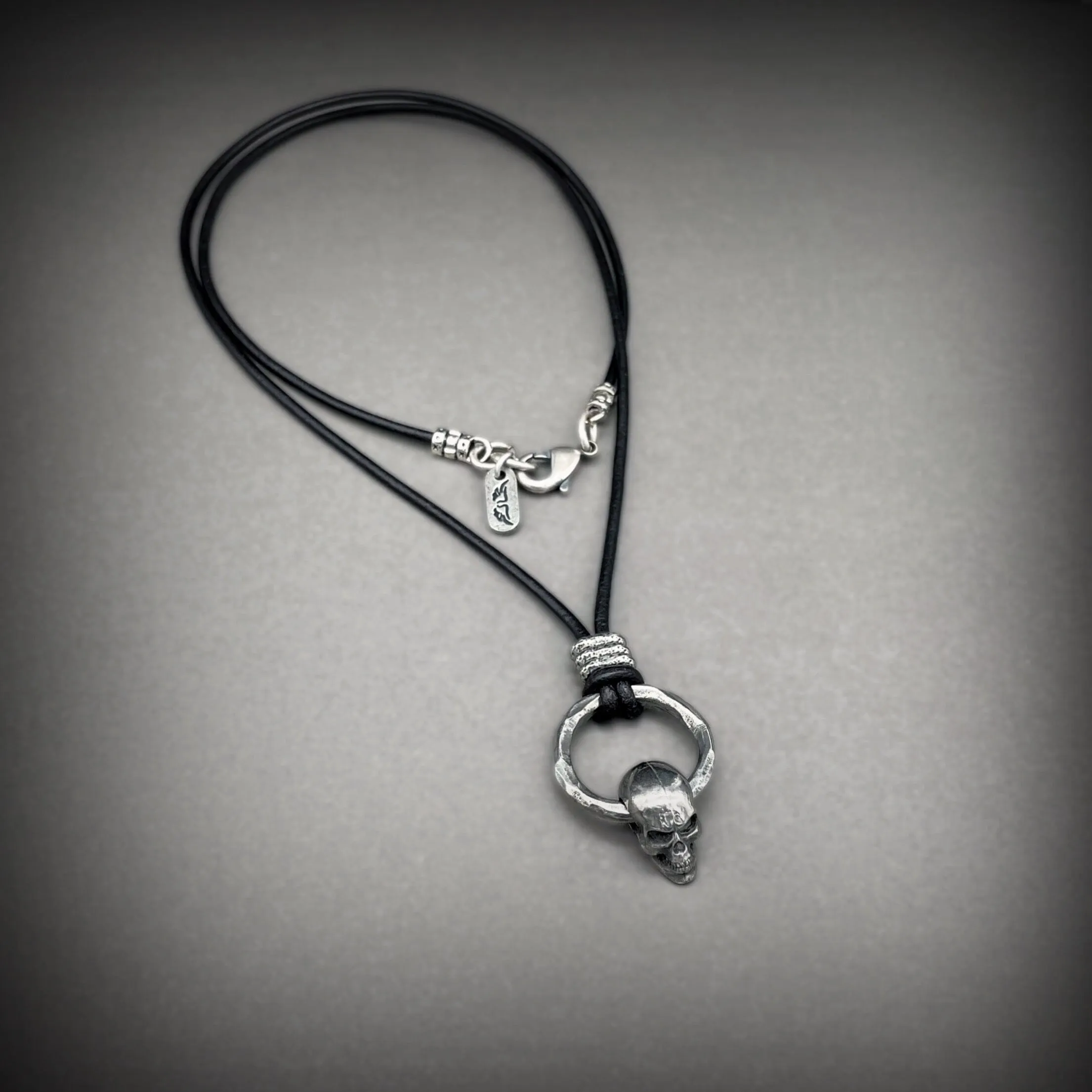 Draven Spinning Skull and Ring Pendant